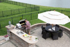 Outdoor kitchens certainly seem appealing in the summer when you want to be outside barbecuing. Here are five other benefits of outdoor kitchens.